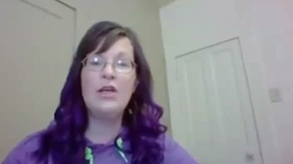 A salon owner talking on a video call